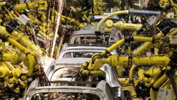 Robotic machines weld bodies of Kia cars in its factory in Zilina